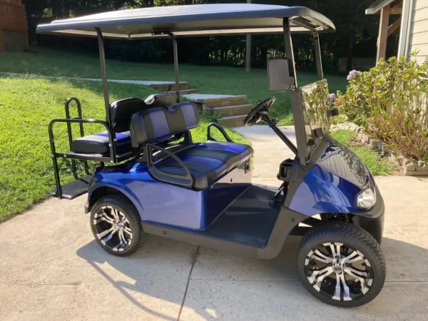 EZGO RXV with inch vampire black machined golf cart wheels and dot low profile tires webp